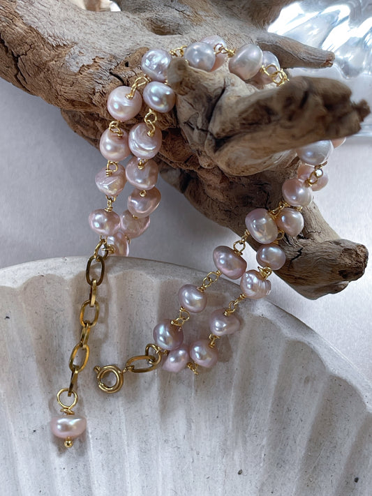 Pulsera de perlas rosa